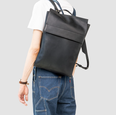 handcrafted leather backpack with pocket and secure magnetic closure